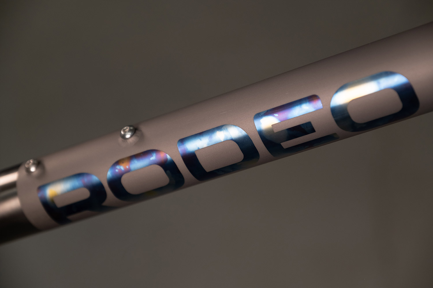 Multi color tie dye anodized titanium gravel bike. Flaanimal 5 Titanium bicycle by Rodeo Labs.