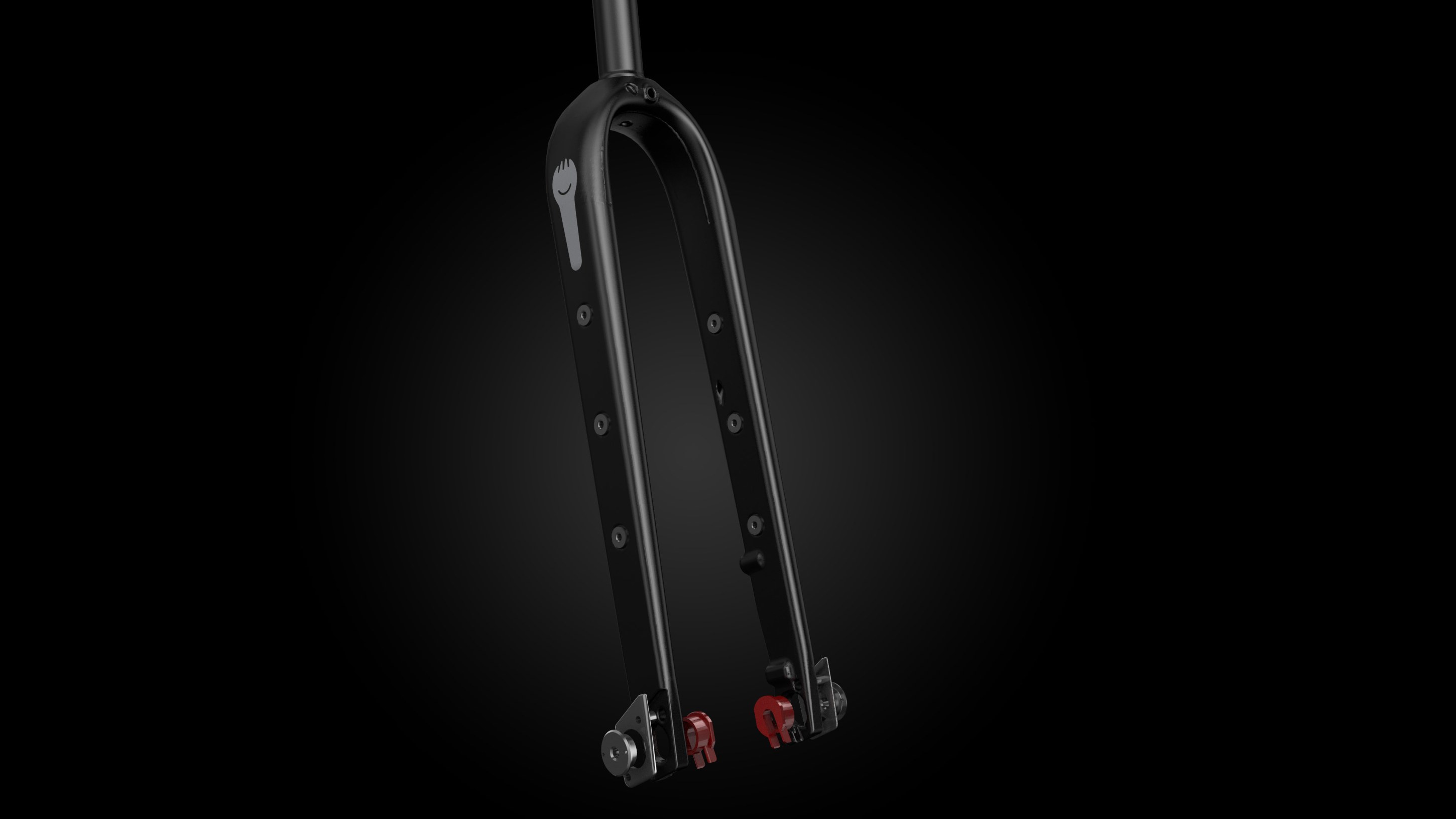 A close-up image of a black bike fork with visible mounting holes and red fasteners, set against a black background.
